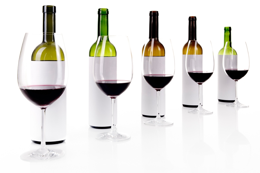 Blind wine tasting on white, masked labels of wine bottles, selective focus